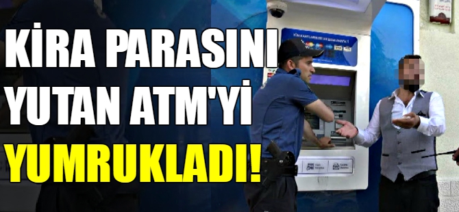 Kira parasını yutan ATM'yi yumrukladı
