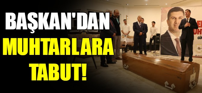 Başkan muhtarlara tabut hediye etti