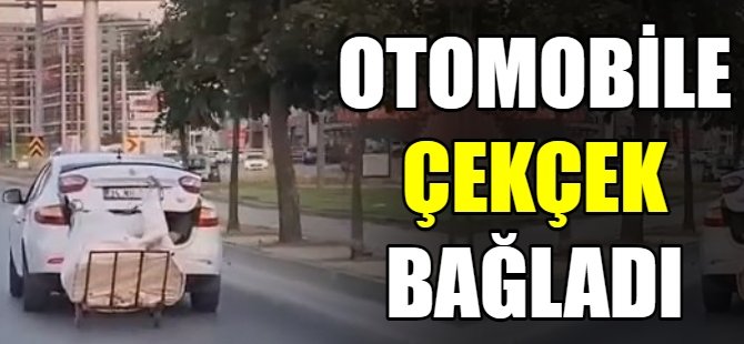 Otomobiline çekçek araba bağladı