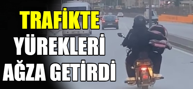 Motosikleti ile bebek taşıdı